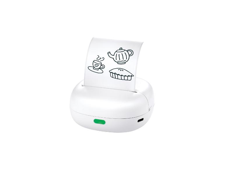 Imprimante thermique portable blanche avec des dessins de théière, tasse et tarte.