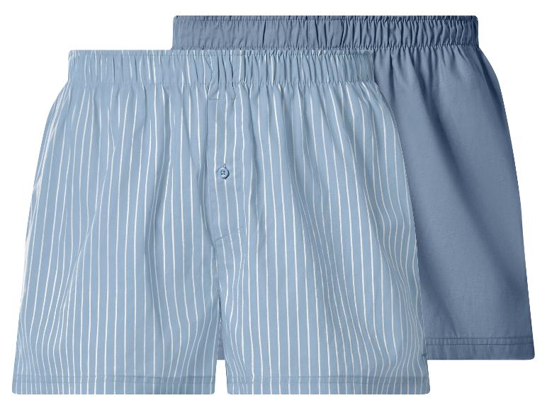 Deux boxers bleus, un rayé et un uni.