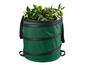Une poubelle pliable verte remplie de feuilles.
