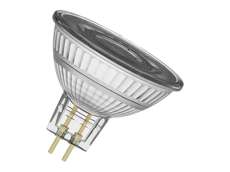 Ampoule halogène à deux broches, inclinée sur un fond blanc.