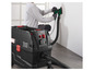 Un aspirateur noir Parkside avec une ponceuse verte.