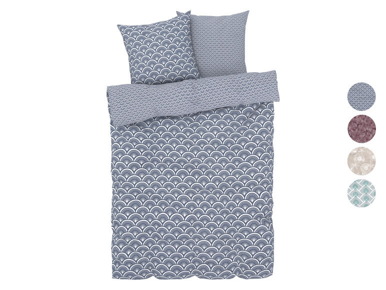 Une housse de couette avec un motif géométrique dans des tons bleus et blancs.