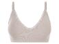 Un soutien-gorge beige à côtes avec de la dentelle.