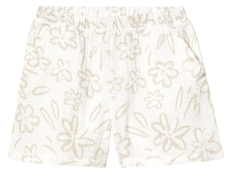 Shorts enfant à fleurs beige clair.