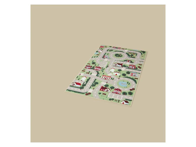 Tapis de jeu pour enfants avec une carte de ville, des routes, des maisons et des arbres.