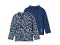 Deux t-shirts à manches longues: l'un avec un imprimé floral et l'autre uni bleu foncé.