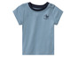 Un t-shirt pour bébé bleu clair avec un col bleu foncé et un imprimé de mouette avec le texte 'Sea Captain'.