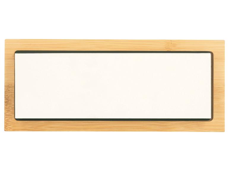 Tableau blanc rectangulaire avec cadre en bois de bambou.