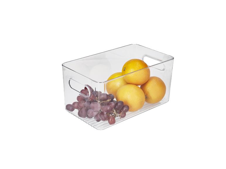 Boîte de rangement transparente avec raisins et oranges.