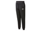 Pantalon de survêtement noir avec un logo de marque.
