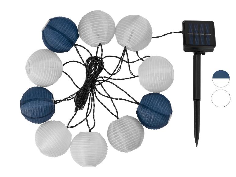 Guirlande lumineuse solaire avec des lanternes bleues et blanches.
