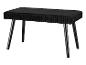 Un banc en velours noir avec des pieds noirs.
