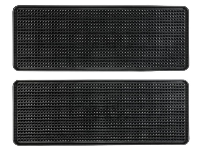 Deux tapis en caoutchouc noirs avec des picots.