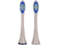Deux têtes de brosse à dents électrique de rechange avec des poils bleus, blancs et turquoises.