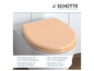 Un abattant de toilettes beige de Schütte avec fermeture douce.