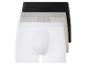 Trois paires de boxers en blanc, gris et noir.