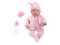 Poupée bébé en pyjama et veste roses avec tétine et biberon.