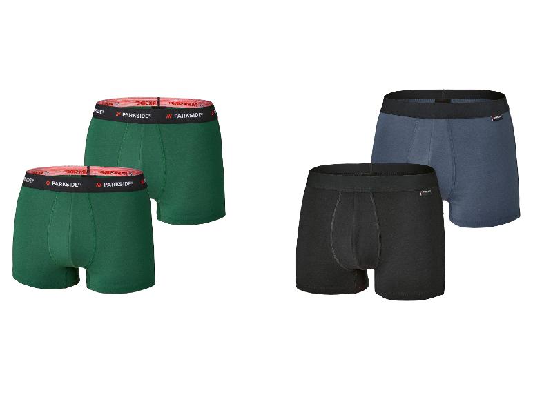 Quatre boxers Parkside : deux verts avec bande rouge, un noir et un bleu avec bandes noires.
