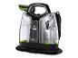 Nettoyeur de taches portable Bissell SpotClean Pet Select avec réservoirs d'eau transparents et tuyau noir.