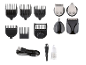 Accessoires pour tondeuse, incluant des sabots, des têtes de rechange, un câble USB, une brosse et de l'huile.