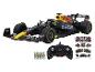 Une maquette de voiture de course de Formule 1 Red Bull noire et jaune avec une télécommande.