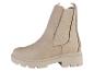 Bottines Chelsea beige avec une semelle épaisse.