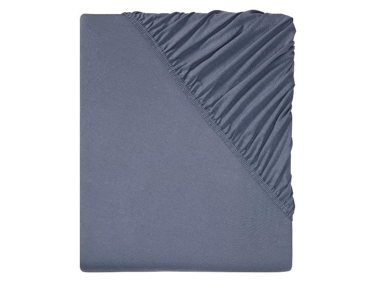 Drap en coton bleu avec élastique.