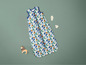 Un sac de couchage pour bébé avec un imprimé amusant de légumes.
