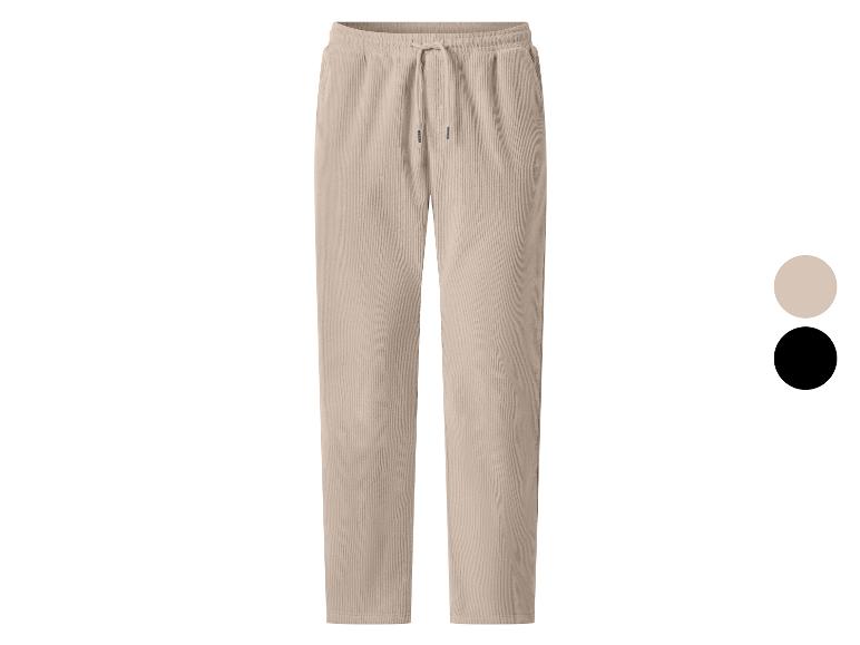 Pantalon en velours côtelé beige pour homme avec cordon de serrage à la taille, également disponible en noir.