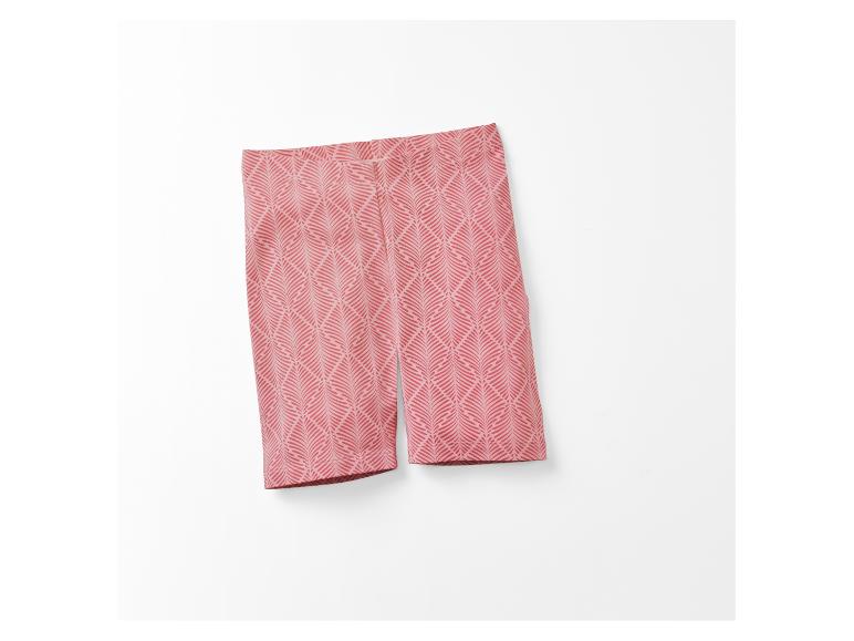 Short cycliste rose à motif feuillage.