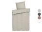 Parure de draps beige clair.