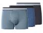 Trois boxers pour hommes dans des tons de bleu et de gris avec des ceintures rayées.