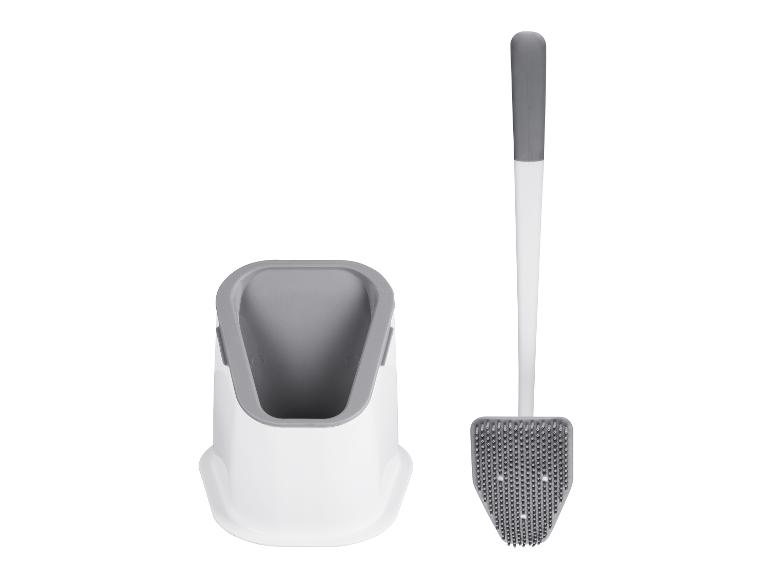 Ensemble de brosse de toilette et support, design moderne gris et blanc.