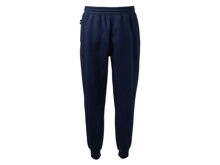 Pantalon de survêtement bleu foncé sur fond blanc.