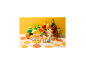 Jouets sur le thème des fruits avec des figurines d'animaux, des boissons et un panier de fruits.