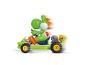Kart jouet CARRERA Mario Kart avec Yoshi roulant à toute vitesse.
