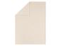 Couverture polaire beige pliée