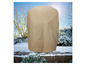Une housse de protection beige pour un chauffage de terrasse dans un jardin enneigé.