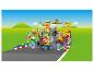 Ensemble LEGO Mario Kart avec personnages et véhicules sur une piste de course.