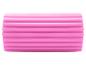 Rouleau de massage rose avec rainures horizontales