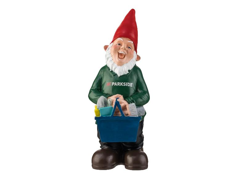 Un gnome souriant avec une boîte à outils Parkside.