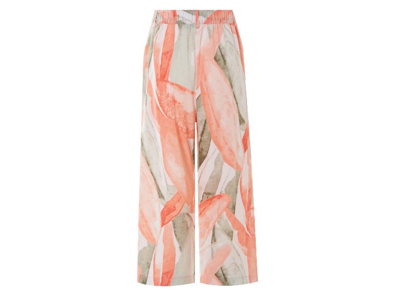 Pantalon large à motif floral, tons corail et vert clair.