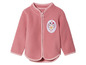 Une veste en polaire rose avec un motif floral.