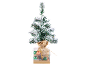 Petit sapin de Noël enneigé dans une boîte décorative avec des boules.