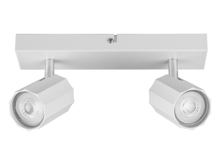 Plafonnier blanc avec deux lumières LED rondes.