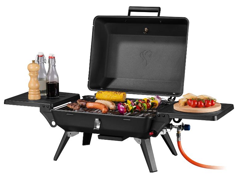 Barbecue à gaz portable avec nourriture, épices et boissons