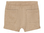 Short beige avec poches arrière.