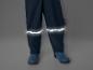 Pantalon imperméable bleu foncé avec des bandes réfléchissantes et le logo 3M.