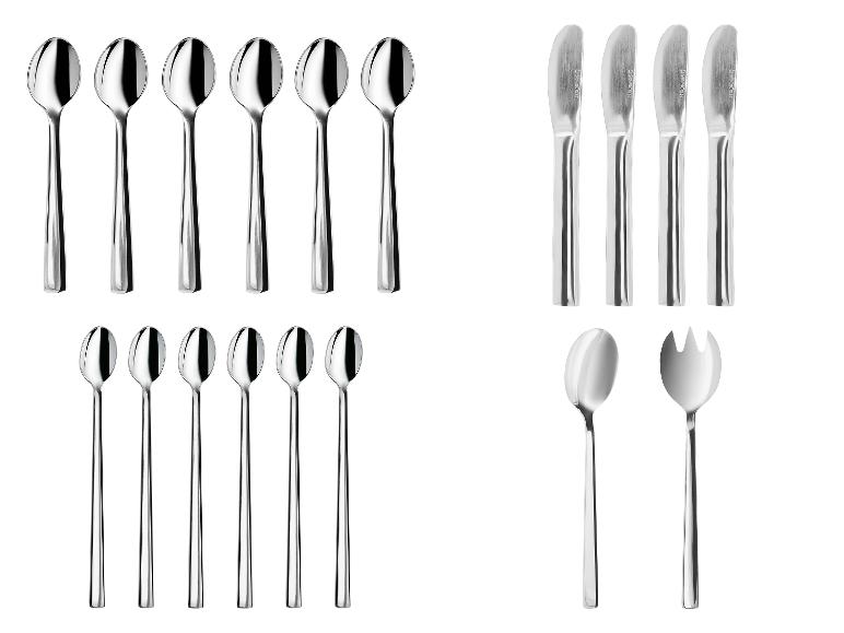 Ensemble de couverts en acier inoxydable comprenant cuillères, couteaux et ustensiles de service.