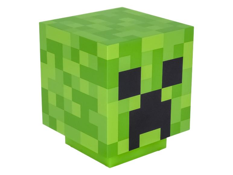 Cube vert pixélisé avec des traits faciaux noirs, ressemblant à un personnage de jeu vidéo.